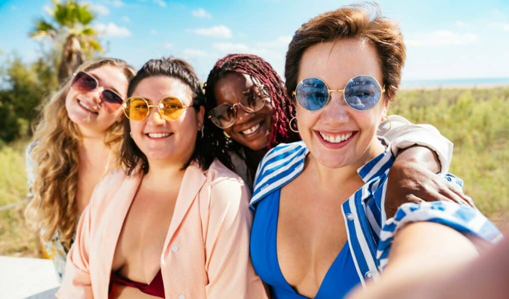 Group of plus size women with swimwear at the beach